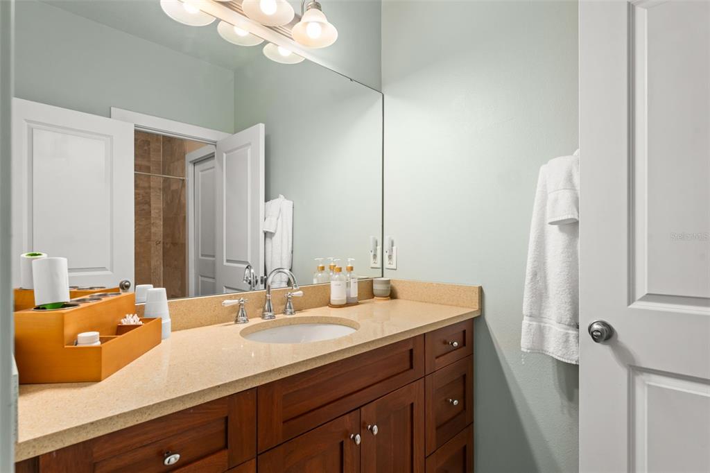 2223 Amherst Avenue Orlando, FL 32804 - Photo 29 of 64 a bathroom with a sink vanity granite and a mirror