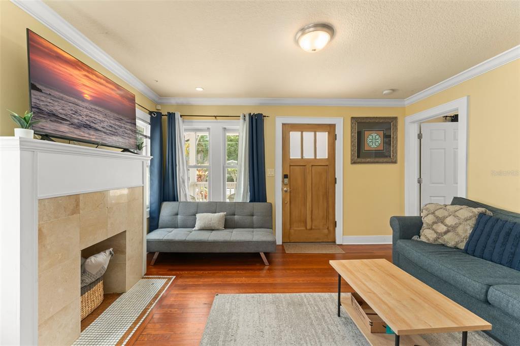 2223 Amherst Avenue Orlando, FL 32804 - Photo 34 of 64 a living room with furniture and a fireplace