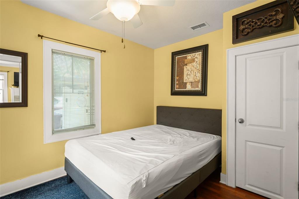 2223 Amherst Avenue Orlando, FL 32804 - Photo 36 of 64 a bedroom with a bed and a window