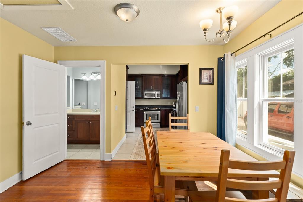2223 Amherst Avenue Orlando, FL 32804 - Photo 39 of 64 a view of a dining room with furniture and wooden floor