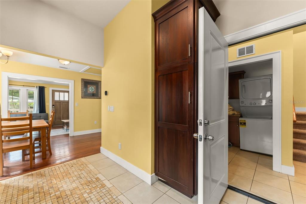 2223 Amherst Avenue Orlando, FL 32804 - Photo 45 of 64 a view of a hallway with dining room and wooden floor