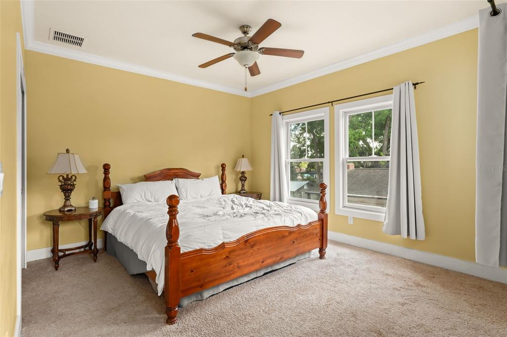 2223 Amherst Avenue Orlando, FL 32804 - Photo 47 of 64 a bed sitting in a bedroom next to a window