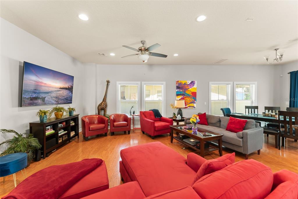 2223 Amherst Avenue Orlando, FL 32804 - Photo 5 of 64 a living room with furniture kitchen view and a flat screen tv