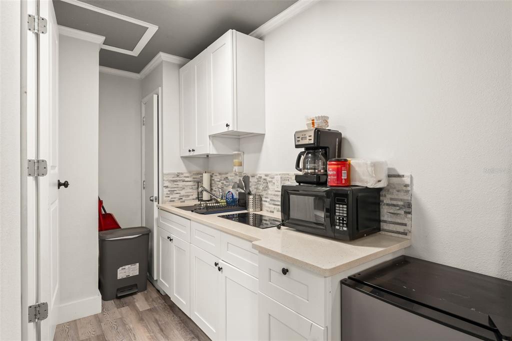 2223 Amherst Avenue Orlando, FL 32804 - Photo 52 of 64 a kitchen with a sink and cabinets