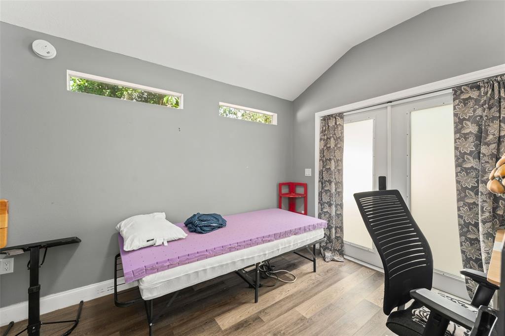 2223 Amherst Avenue Orlando, FL 32804 - Photo 60 of 64 a bedroom with a bed and a window