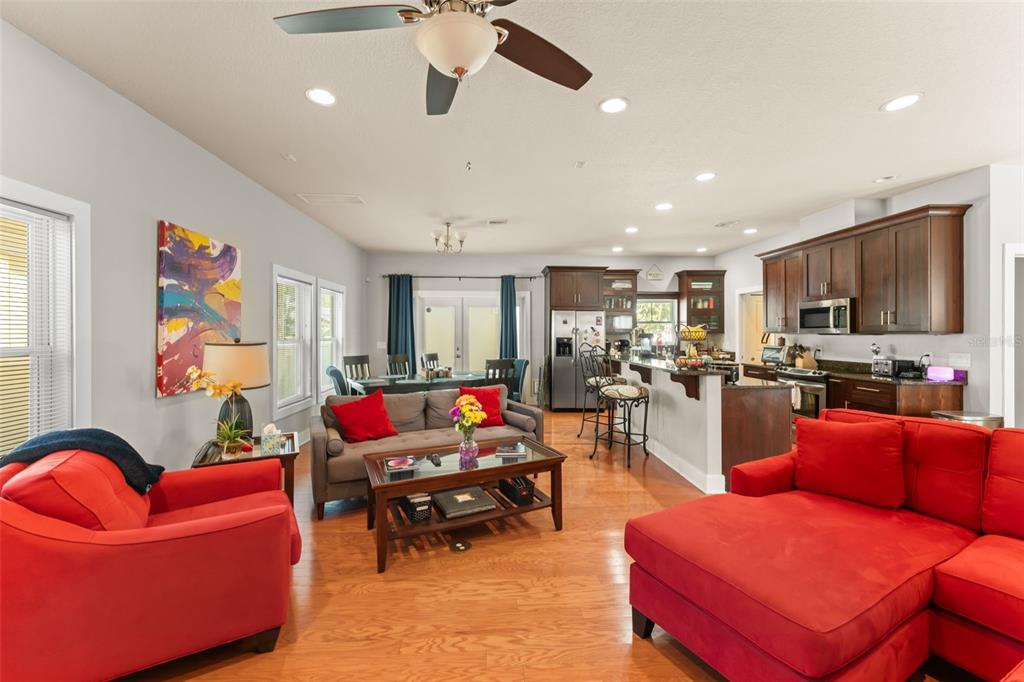 2223 Amherst Avenue Orlando, FL 32804 - Photo 7 of 64 a living room with furniture kitchen view and a flat screen tv