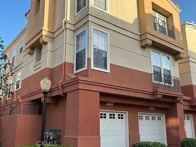 a view of a patio with table and chairs and potted plants