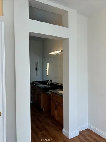 a kitchen with a sink and a stove top oven