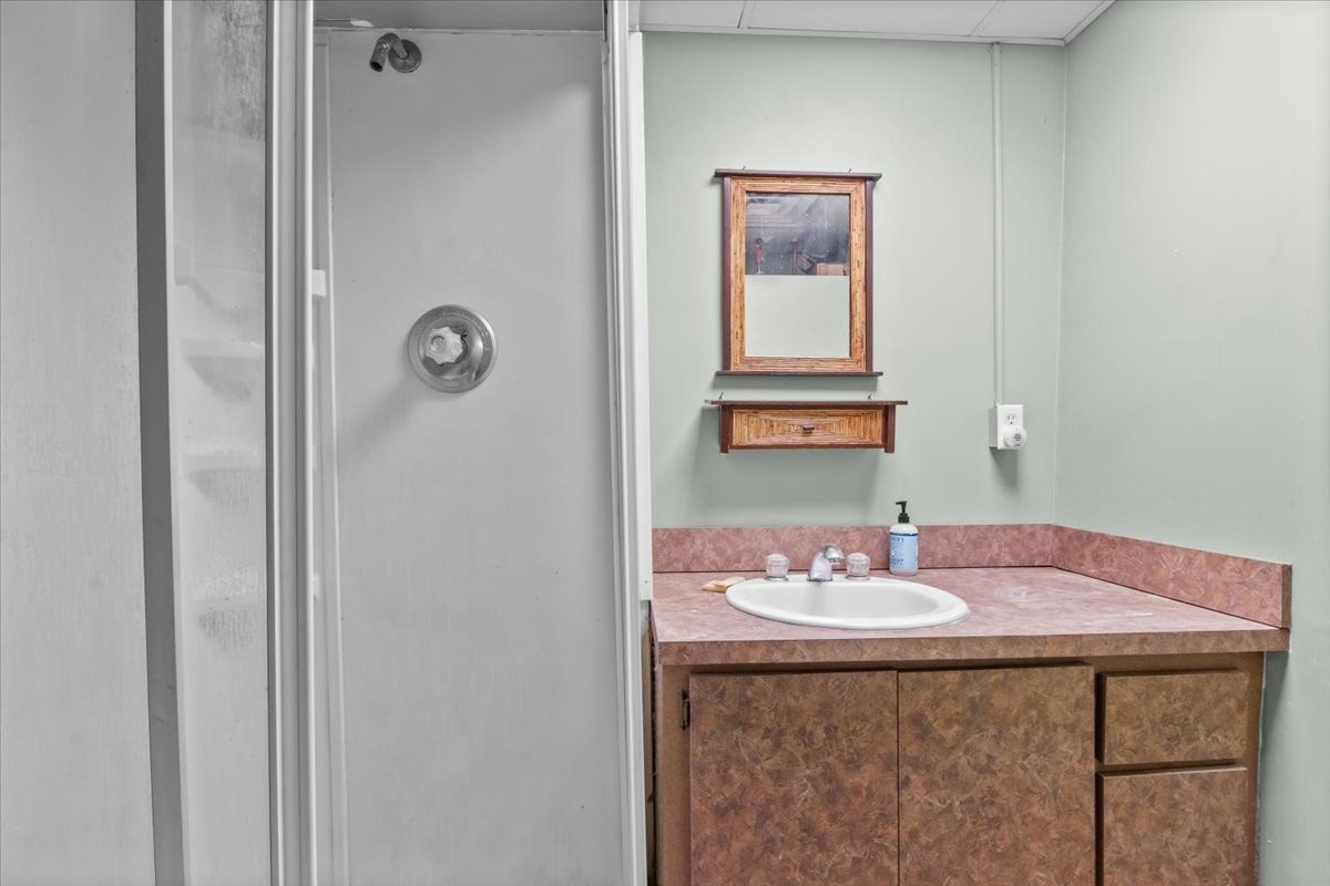 203 East Main Street Waverly, TN 37185 - Photo 21 of 32 a bathroom with a sink and a mirror