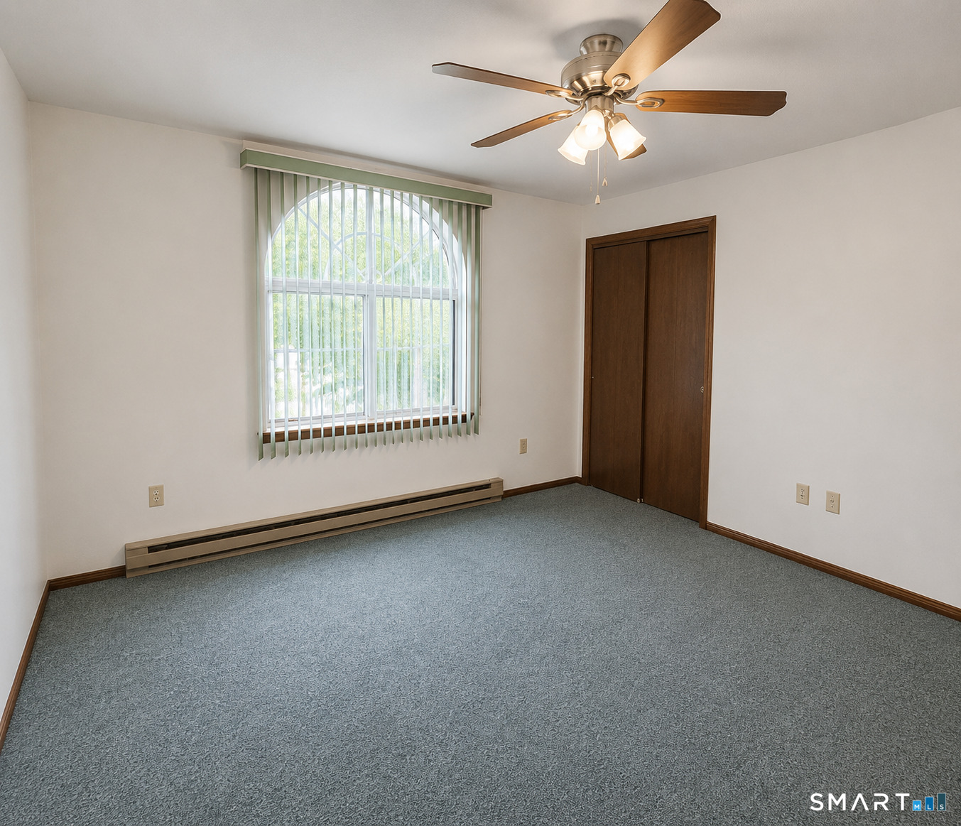 975 Meriden Road, Unit 101 Waterbury, CT 06705 - Photo 23 of 28 an empty room with a window and a fan