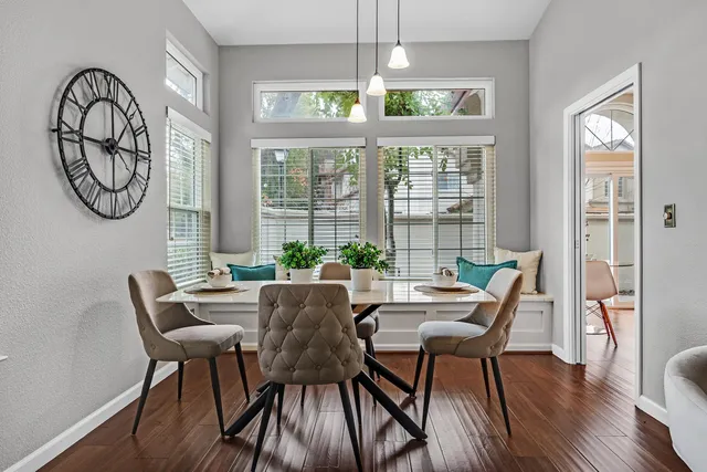 a view of a dining room with furniture window and wooden floor