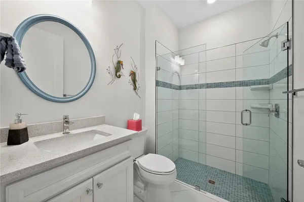 a bedroom with a bed and a night stand