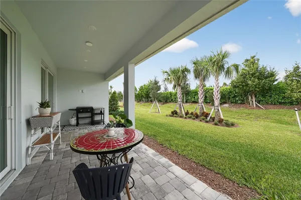 a view of a house with backyard porch and garden