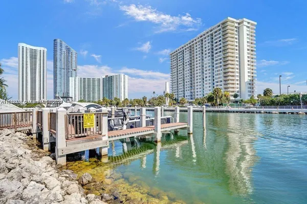 a view of building with lake and tall building