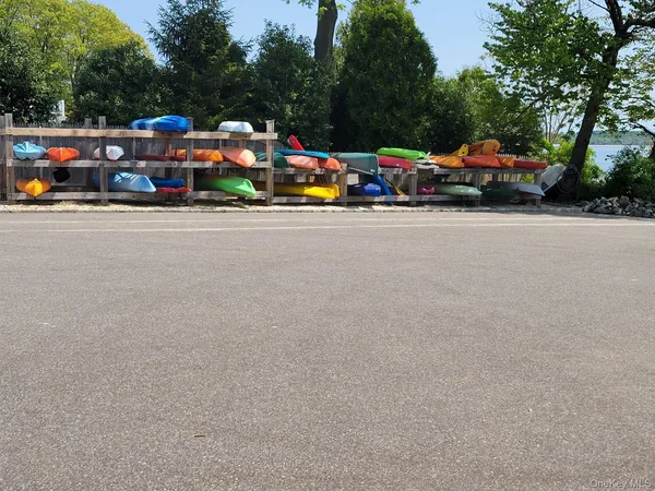 a view of cars parked in front of a house