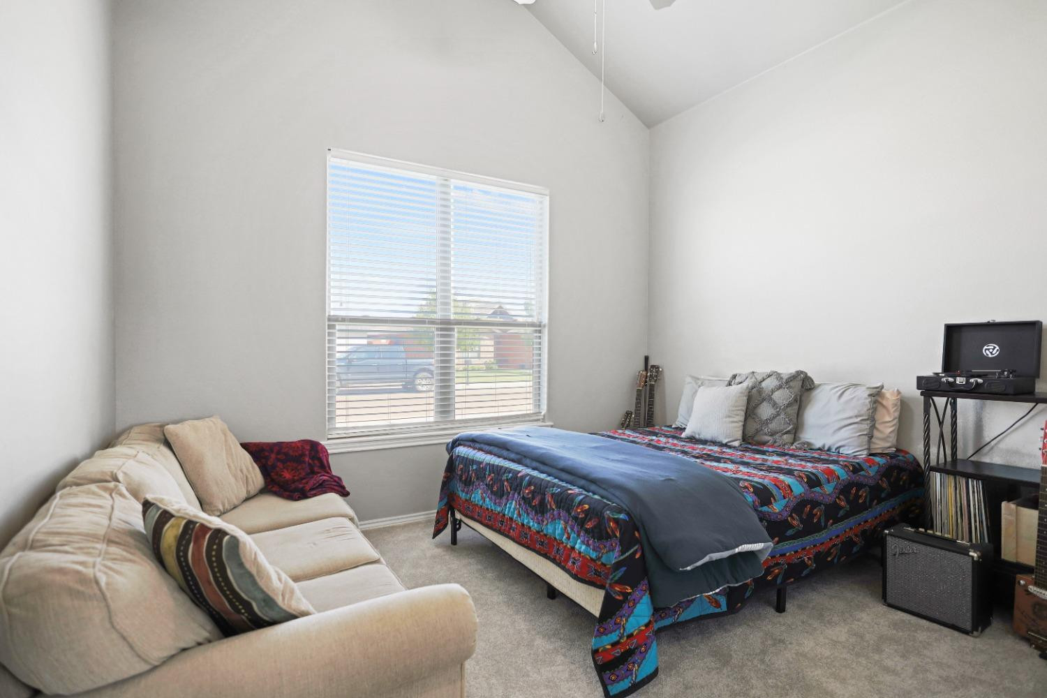 5227 Lehigh Street Lubbock, TX 79416 - Photo 15 of 33 a bedroom with a bed and a window