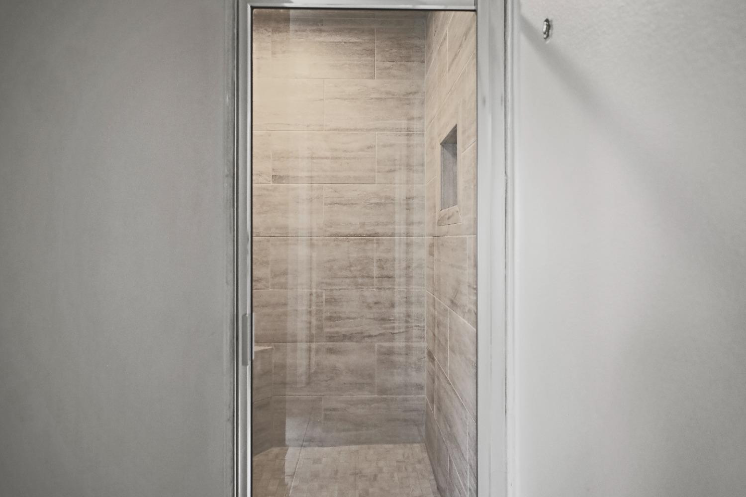 5227 Lehigh Street Lubbock, TX 79416 - Photo 23 of 33 a bathroom with a shower