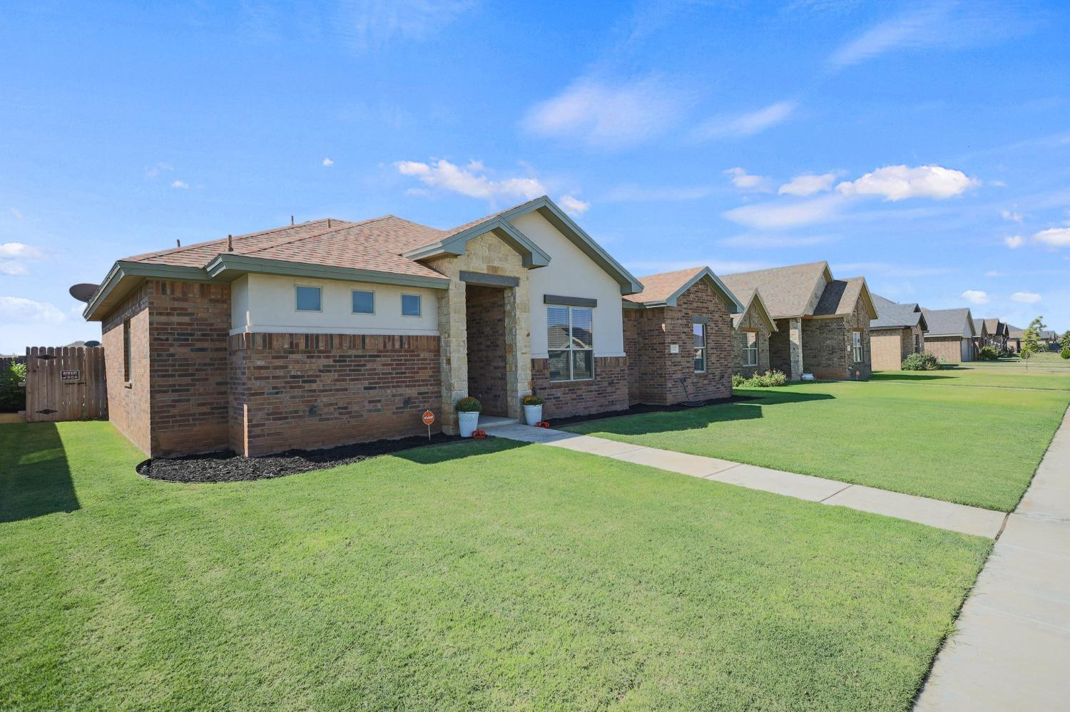 5227 Lehigh Street Lubbock, TX 79416 - Photo 6 of 33 a front view of a house with a garden