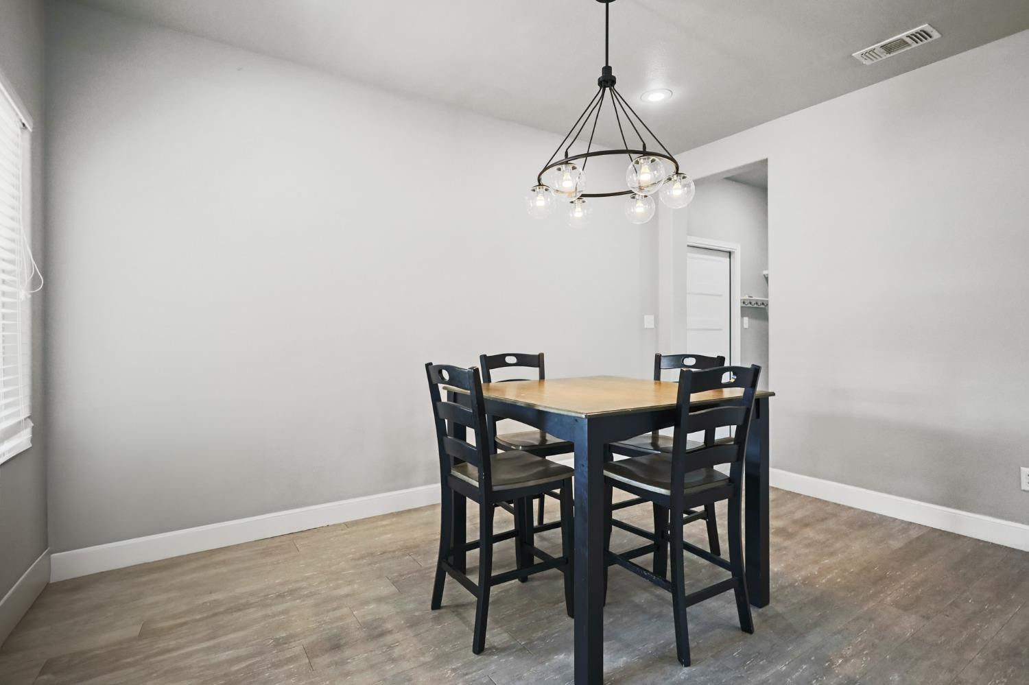 5227 Lehigh Street Lubbock, TX 79416 - Photo 10 of 33 a view of a dining room with a table and chairs