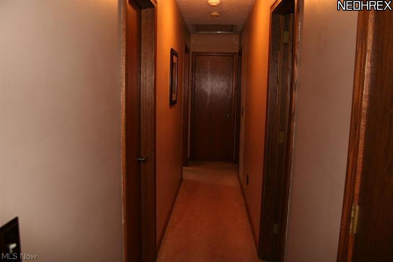 2112 May Road Mogadore, OH 44260 - Photo 7 of 18 Hallway leads to bathroom & bedrooms