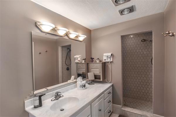 19 Rutgers Road Andover, MA 01810 - Photo 18 of 26 a bathroom with double vanity sinks and a mirror