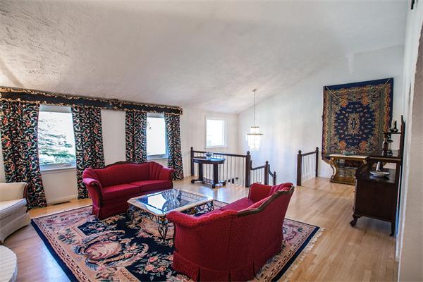 19 Rutgers Road Andover, MA 01810 - Photo 4 of 26 a living room with furniture a wooden floor and a large window