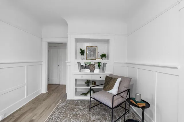 a room with a table and chairs