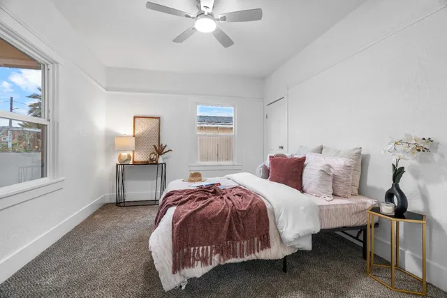 a bedroom with bed and window