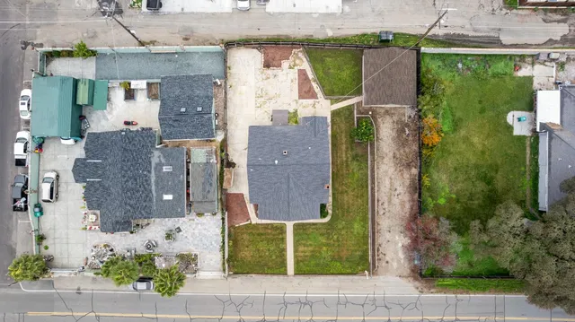 an aerial view of houses with a street