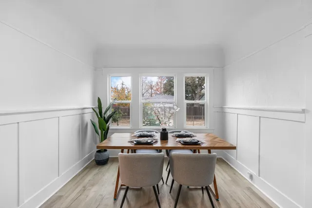 a view of a dining room with furniture window and outside view