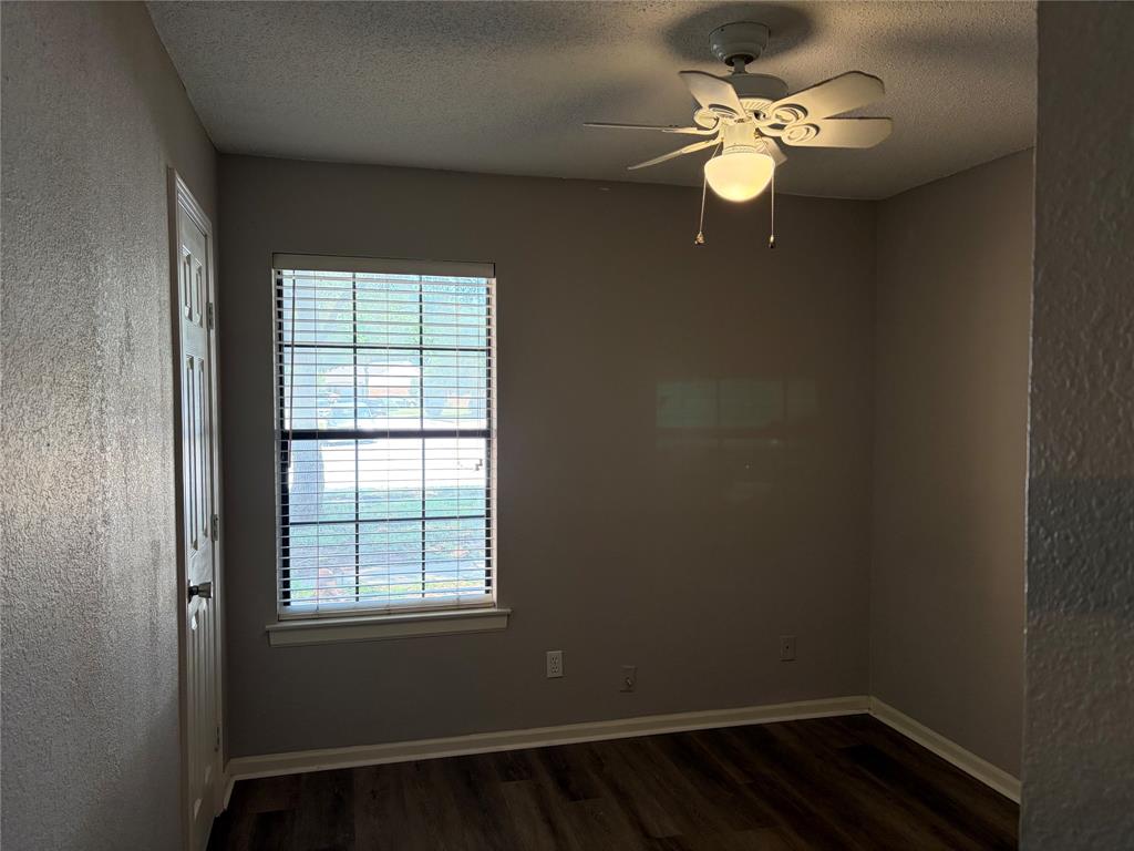 112 Cinnamon Lane Euless, TX 76039 - Photo 7 of 12 wooden floor in an empty room with a window