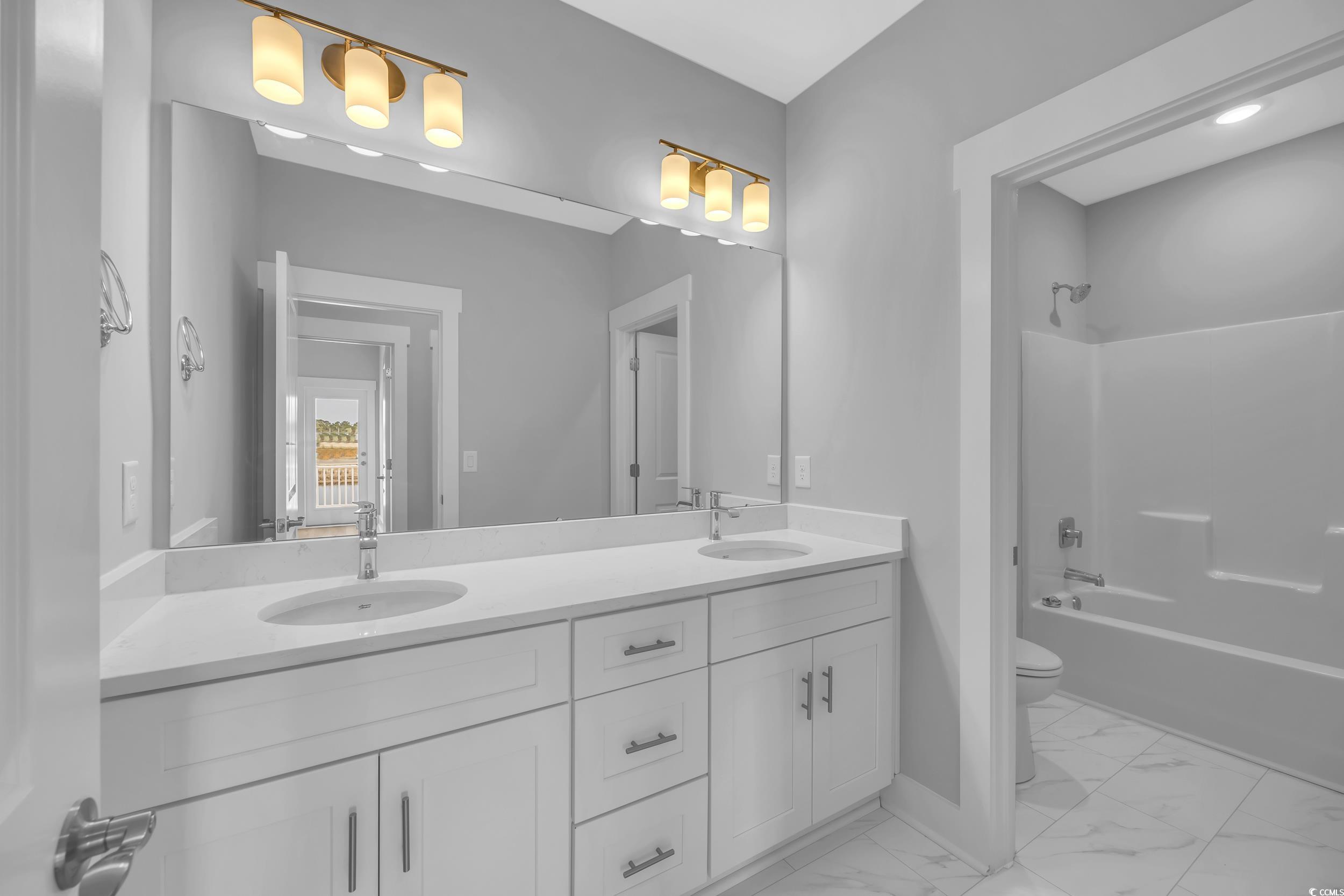 315 Lineback Place, Unit 37 Longs, SC 29568 - Photo 27 of 39 Full bathroom featuring toilet, marble finish floor, a sink, and double vanity
