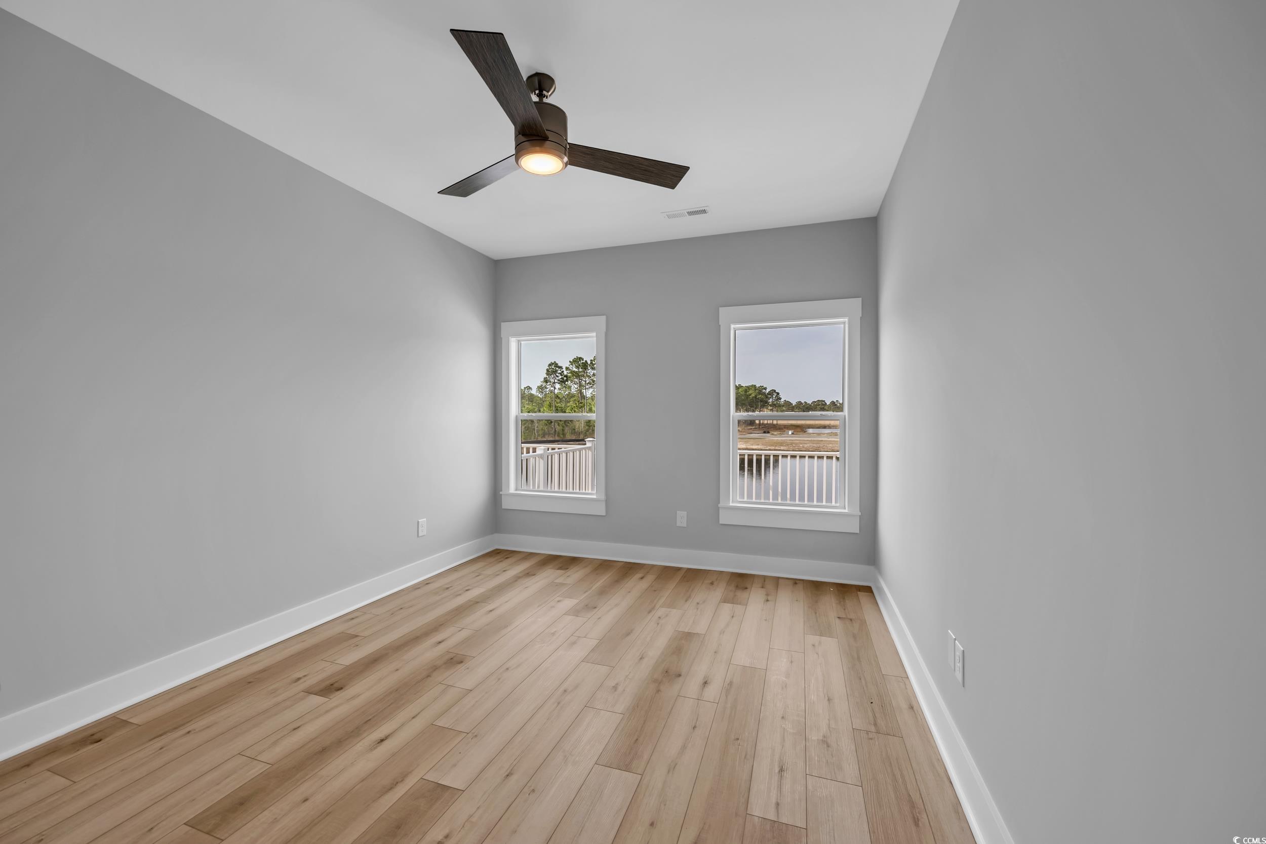 315 Lineback Place, Unit 37 Longs, SC 29568 - Photo 28 of 39 Unfurnished room with light wood-type flooring, baseboards, ceiling fan, and visible vents