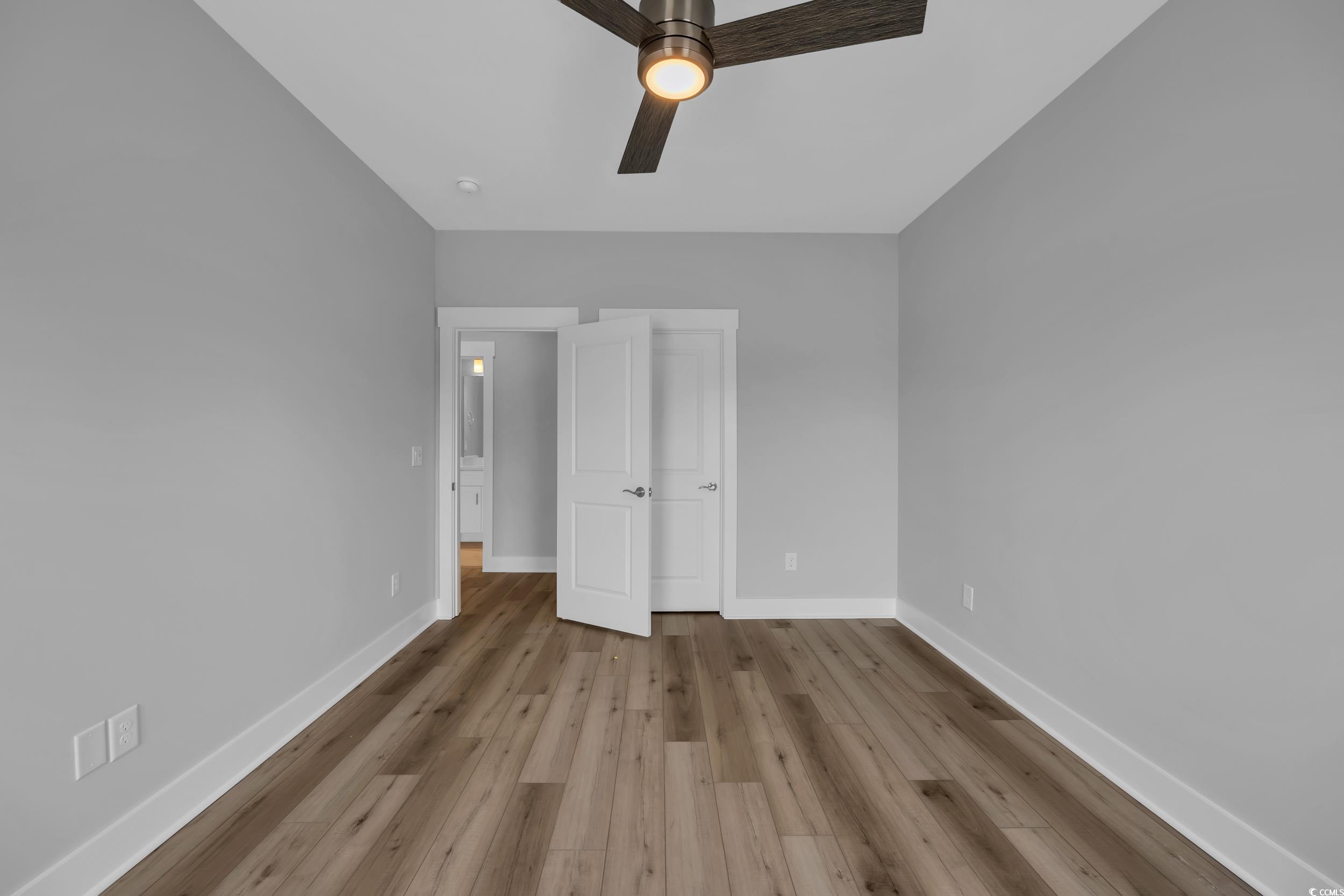 315 Lineback Place, Unit 37 Longs, SC 29568 - Photo 29 of 39 Unfurnished bedroom with baseboards, wood finished floors, and a ceiling fan
