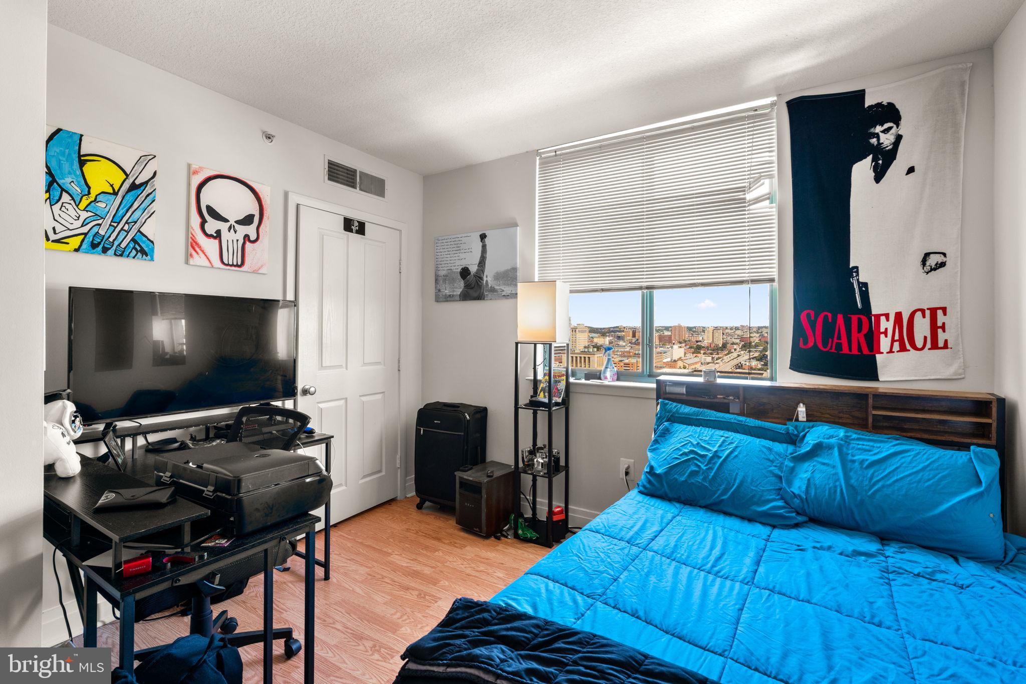 414 Water Street, Unit 2311 Baltimore, MD 21202 - Photo 27 of 44 a living room with furniture and a flat screen tv