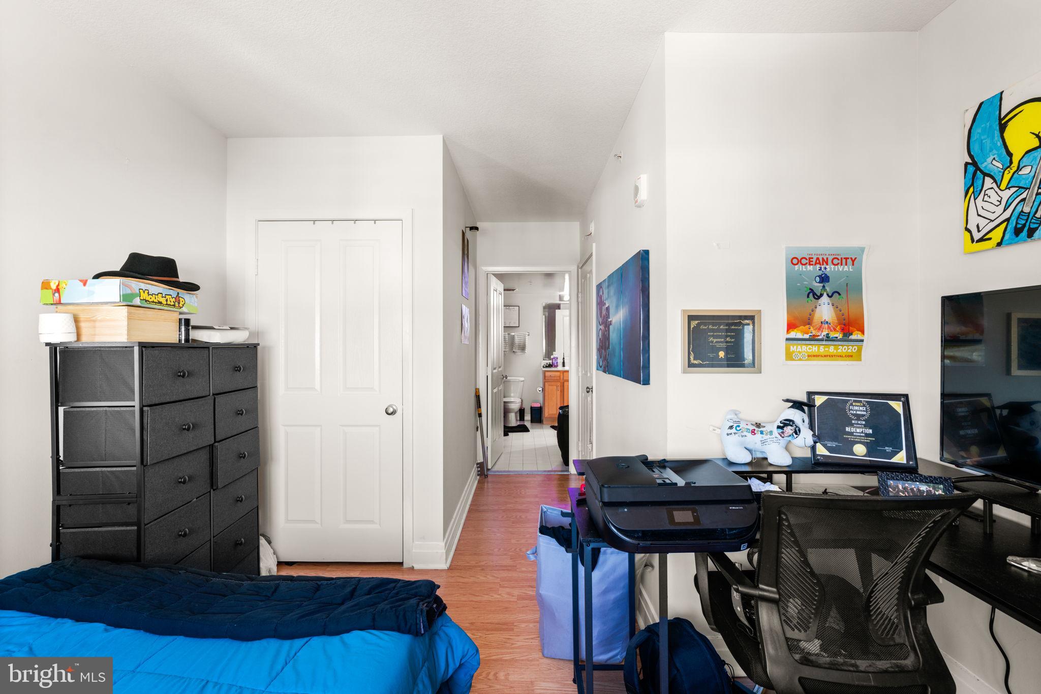 414 Water Street, Unit 2311 Baltimore, MD 21202 - Photo 29 of 44 a view of a workspace with furniture and wooden floor