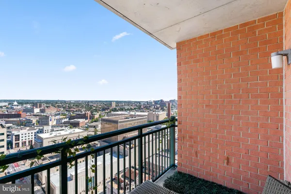 a view of a balcony with city