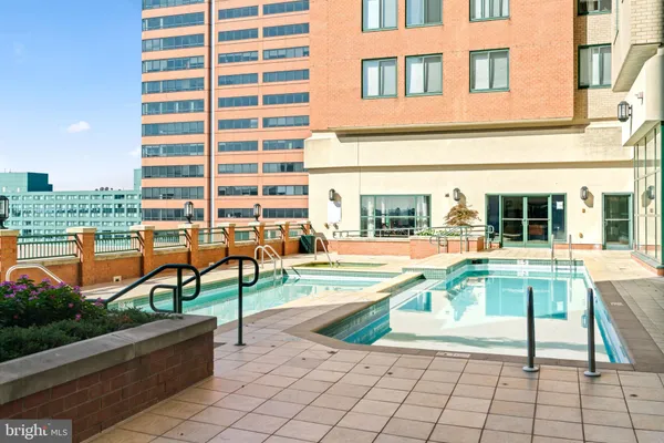 a view of a swimming pool with a lounge chair