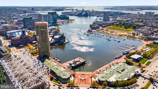an aerial view of a house with a lake view