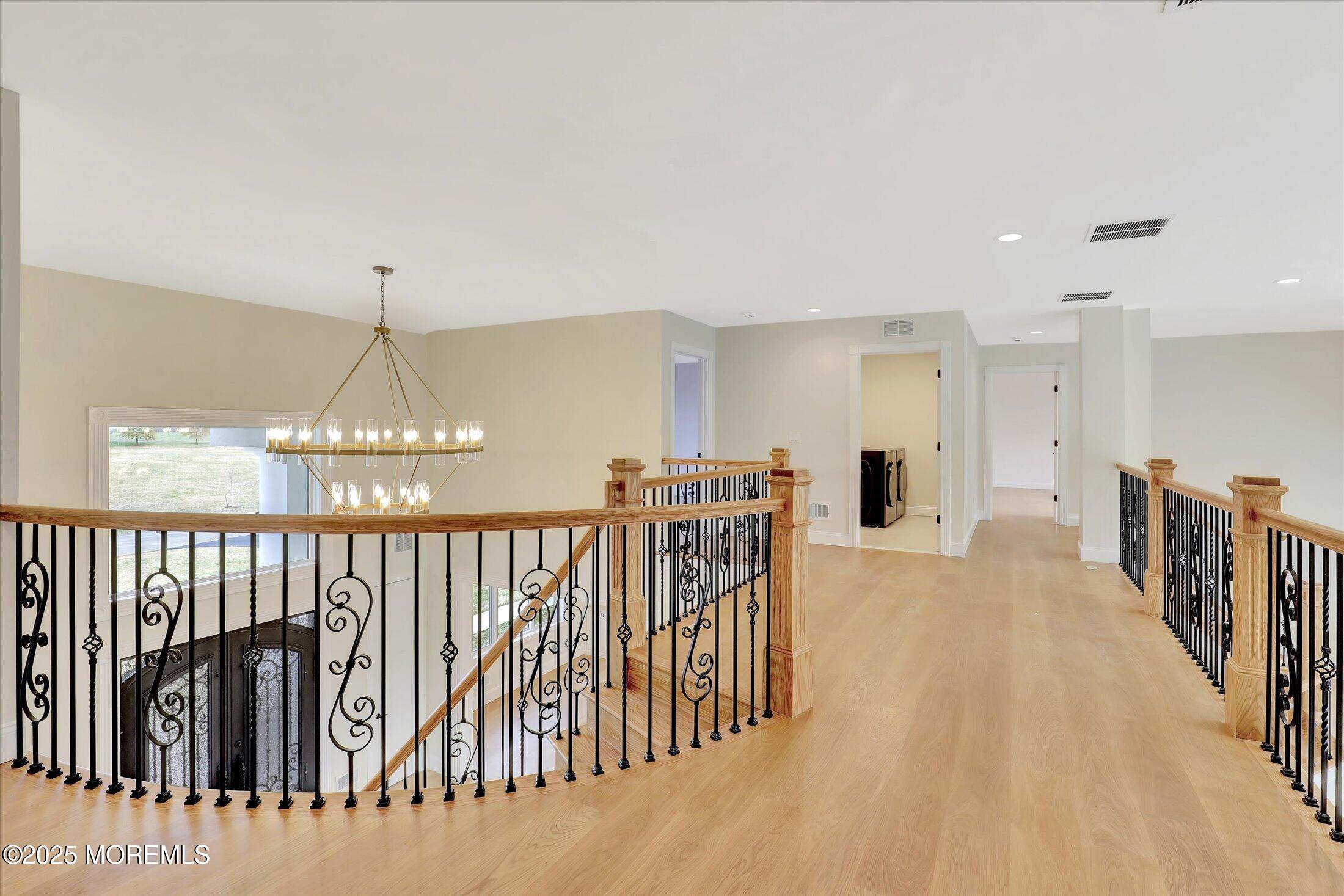 5 Cook Court Millstone Township, NJ 08535 - Photo 16 of 58 a view of a balcony with furniture and chandelier