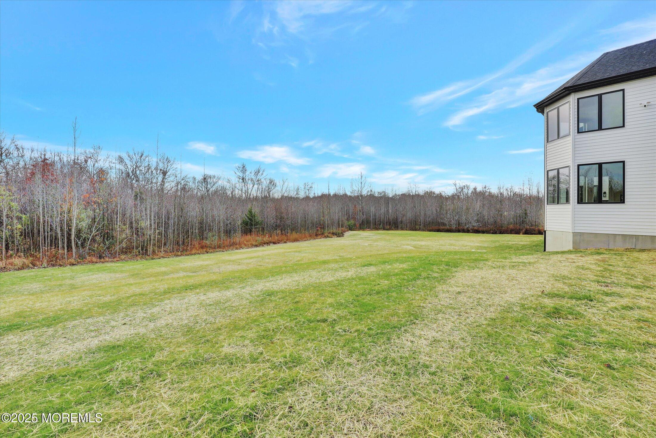 5 Cook Court Millstone Township, NJ 08535 - Photo 25 of 58 a view of a yard with a house in the background