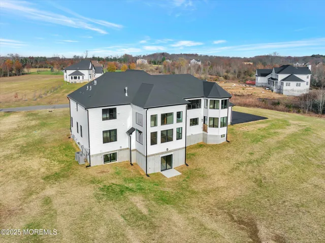 an aerial view of a house with a swimming pool