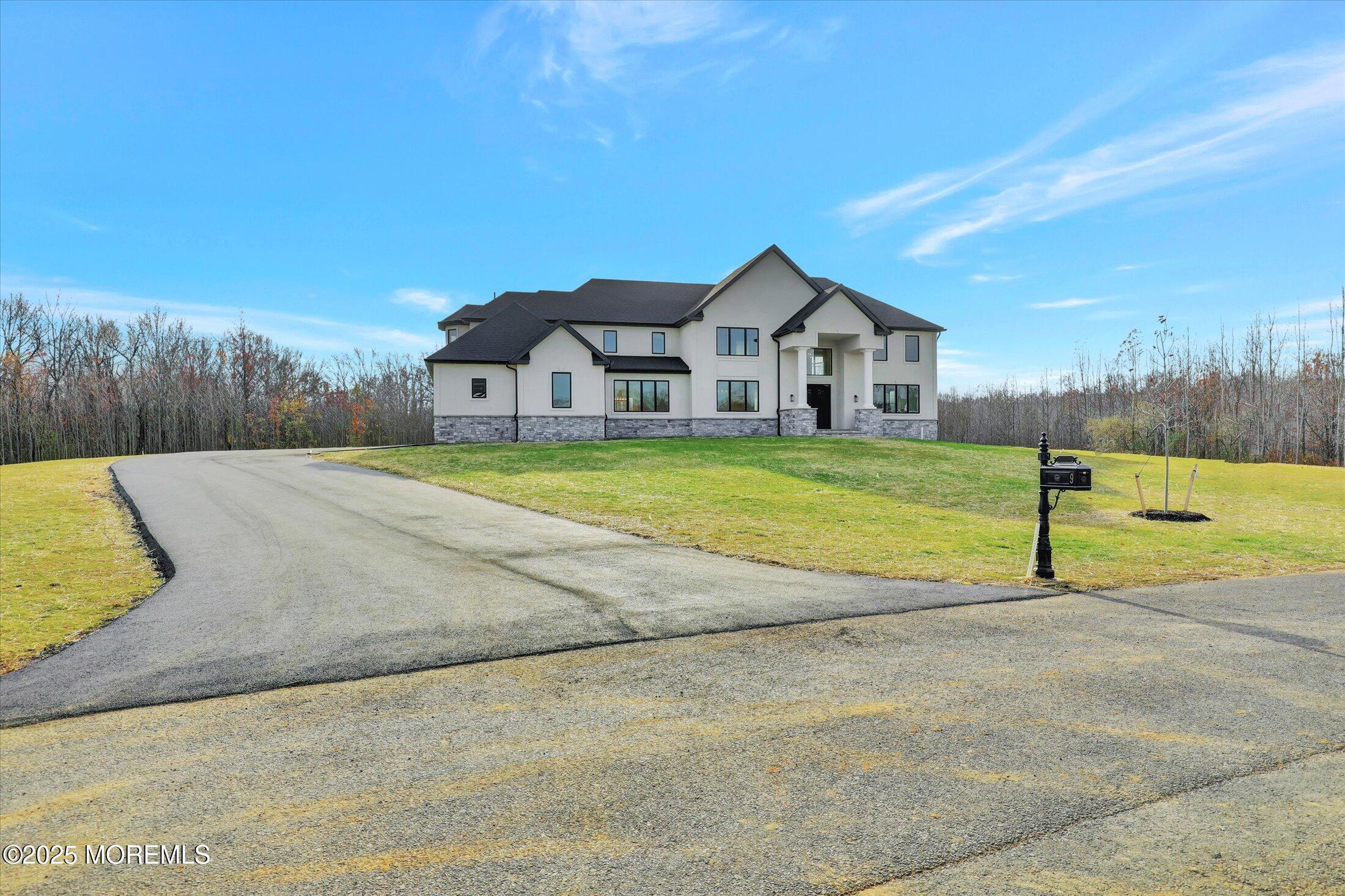 5 Cook Court Millstone Township, NJ 08535 - Photo 5 of 58 a view of a house with a yard and a large tree