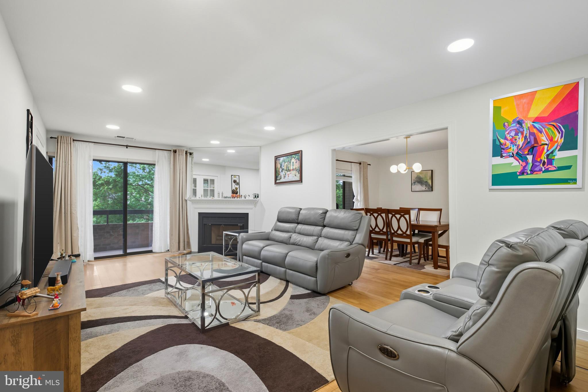 11430 Strand Drive, Unit R203 Rockville, MD 20852 - Photo 1 of 31 a living room with furniture fireplace and flat screen tv
