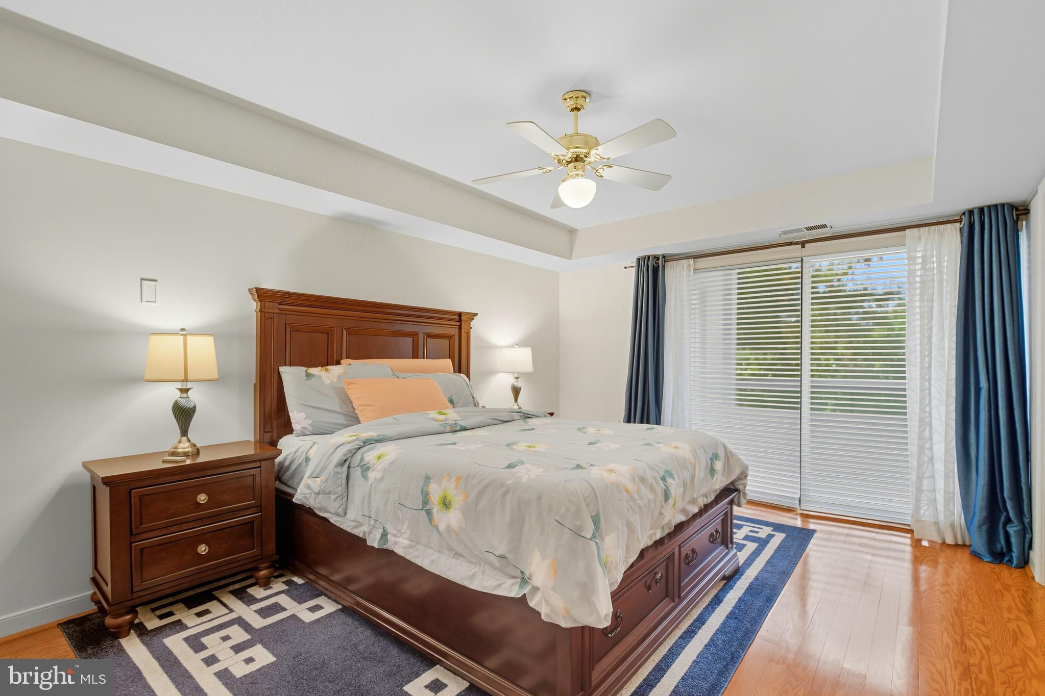 11430 Strand Drive, Unit R203 Rockville, MD 20852 - Photo 14 of 31 a bedroom with a bed dresser and a window