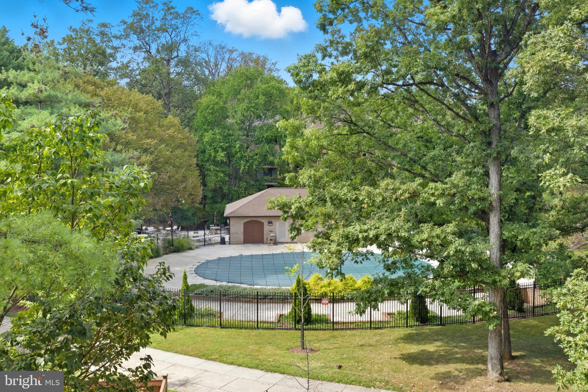 11430 Strand Drive, Unit R203 Rockville, MD 20852 - Photo 20 of 31 a view of a house with a yard