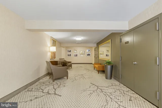 a bathroom with a sink mirror and toilet