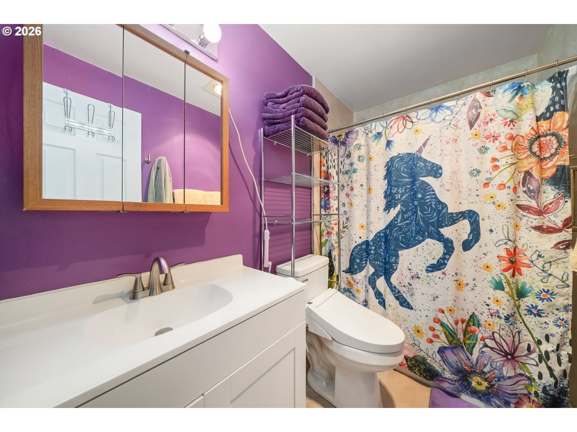 2102 South 8th Street Cottage Grove, OR 97424 - Photo 22 of 28 a bathroom with a sink toilet mirror and vanity