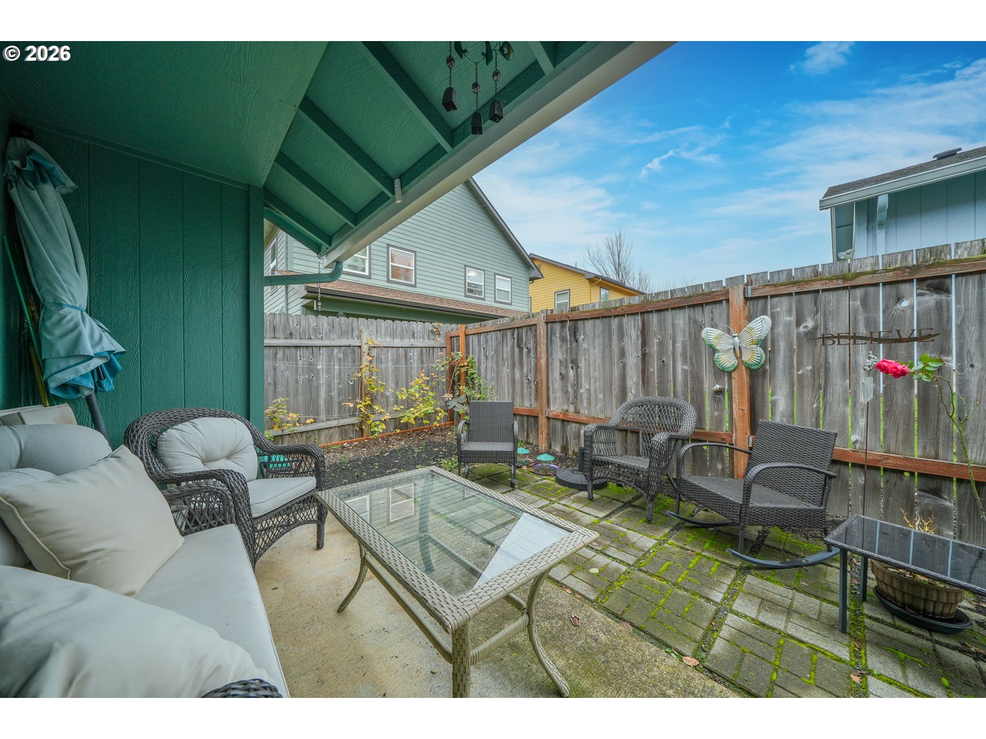 2102 South 8th Street Cottage Grove, OR 97424 - Photo 26 of 28 a outdoor living space with furniture and a black umbrella