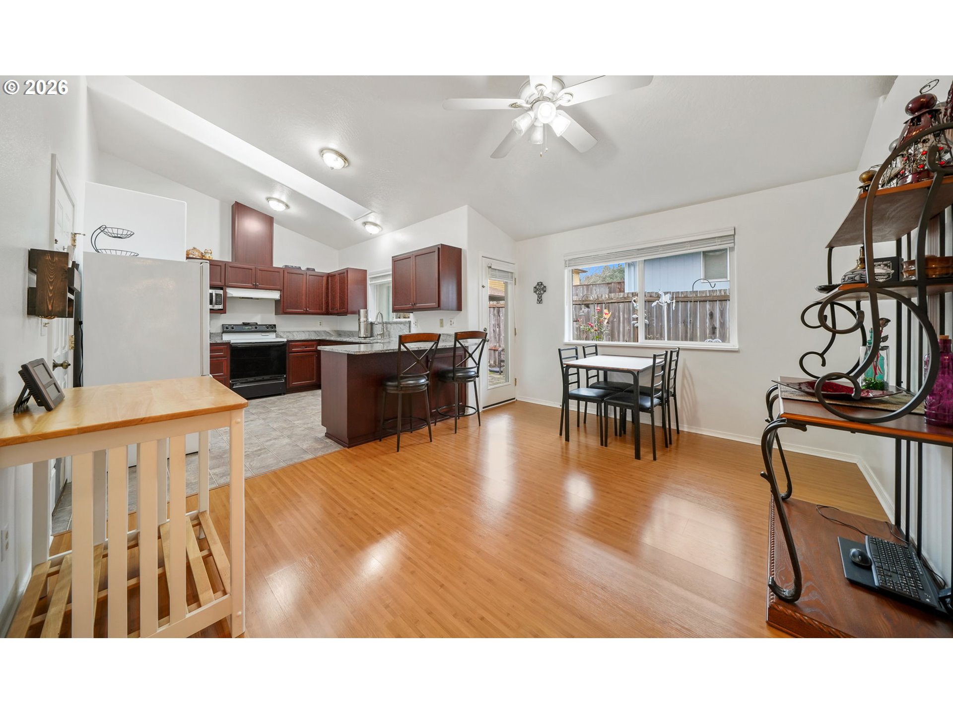 2102 South 8th Street Cottage Grove, OR 97424 - Photo 8 of 28 a living room with stainless steel appliances kitchen island granite countertop furniture and a kitchen view